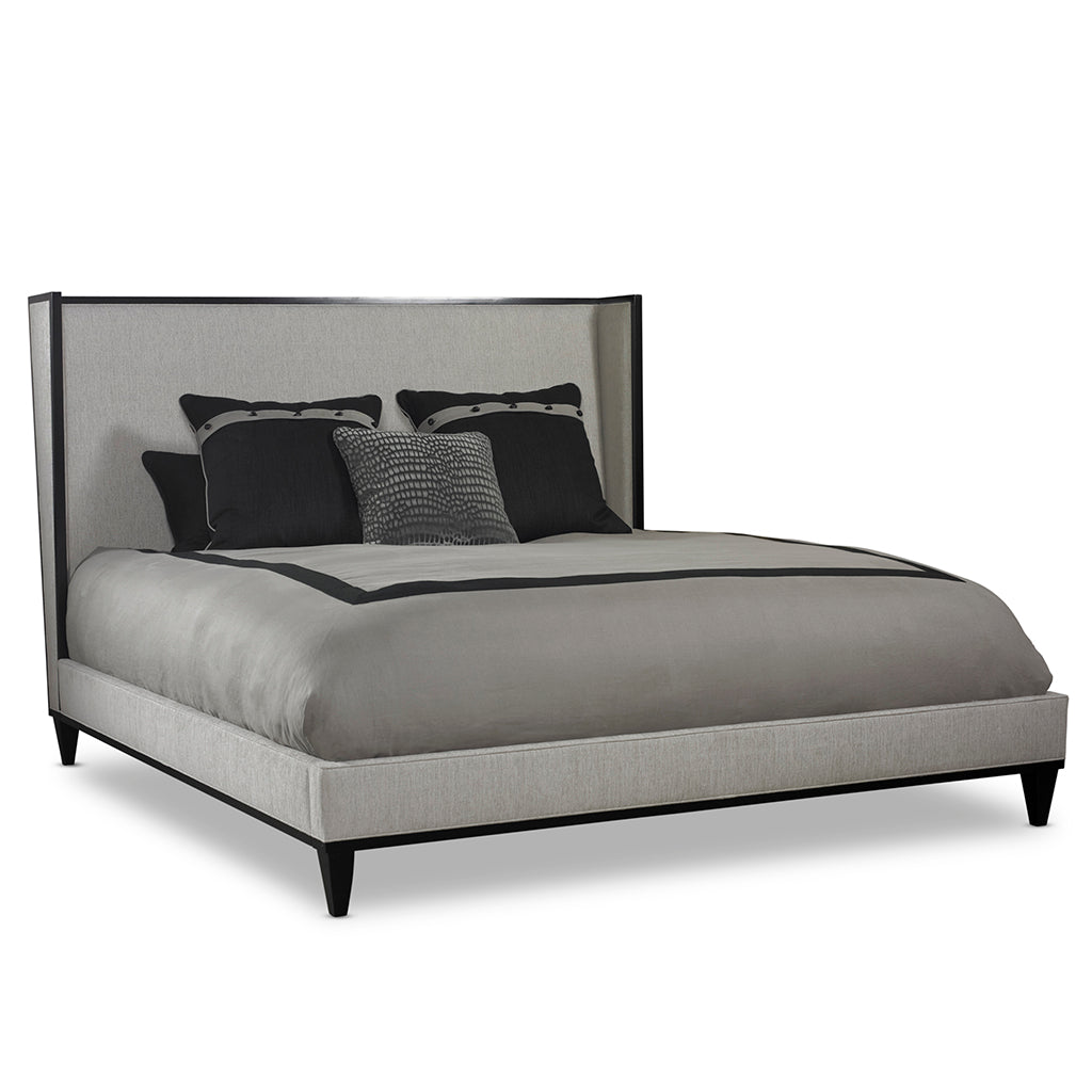 Grey and black modern bed with decorative pillows