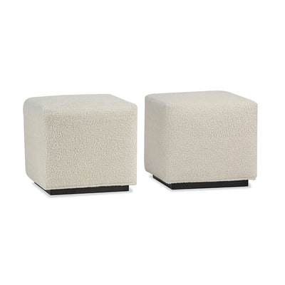 two cube benches in light colored fabric with dark base.
