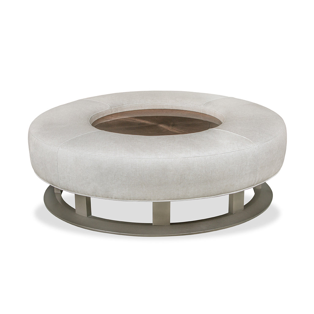 round leather ottoman with glass insert in middle.  